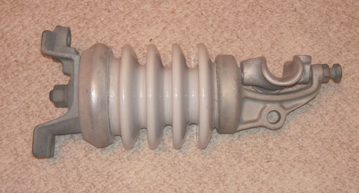 My insulator.
I dunno if you guys have seen one like this before, but I found this on the ground where they were working on some wires for widening Belleview avenue. xD I got this LOOOOONG ago. xD They put some new M-250 R2's up on the road.

Anyway, this was made in the 1970's Vintage insulator. xD Denver uses a lot like this. The wire is held and clamped on by metal and screws, and the insulator keeps it from... Yeah.
Keywords: Miscellaneous