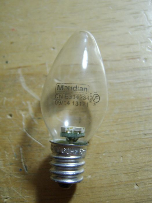 Meridian green 0.5w LED night light bulb
There were two of these, and I accidentally broke one, but this one, was in the green light of my traffic light. It's got three green SMD LEDs in it.
Keywords: Lamps