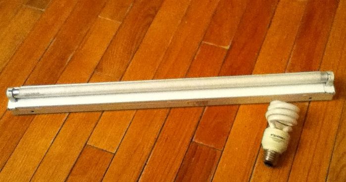 The Tiny Strip Light, Isn't it Cute?
Well I think so, I added the 13 watt CFL for a comparison! This is going in my dad's walk in closet, it is 14 watt T5 and is made by Lithonia. 
Keywords: Indoor_Fixtures
