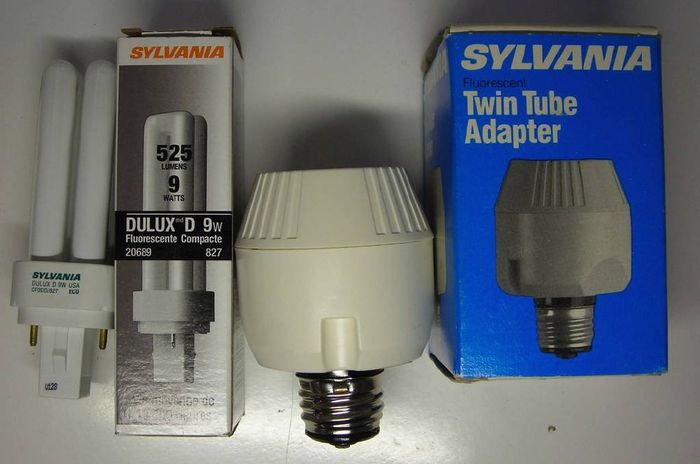  Old Sylvania CFL Adapter and Newer Sylvania Quad Lamp
Here's a older GTE Sylvania 5-7-9W CFL adapter paired with a newer Sylvania 9W quad lamp, The adapter has a rotatable base feature to make fit easier into tight spots. 
Keywords: Lamps
