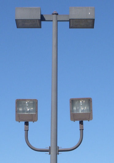 MH parking lot lights.
400 watts I think. At wal-mart. The floods shine at the building. And these are only found next to the building. The rest are just the shoebox lights.
Keywords: American_Streetlights