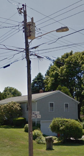 Speaking of Always Seeing These on 6ft Cantilever Arms...
Here you go: 100W MV M-250A2 FCO on a 6ft cantilever arm in Narragansett, RI.
Keywords: American_Streetlights